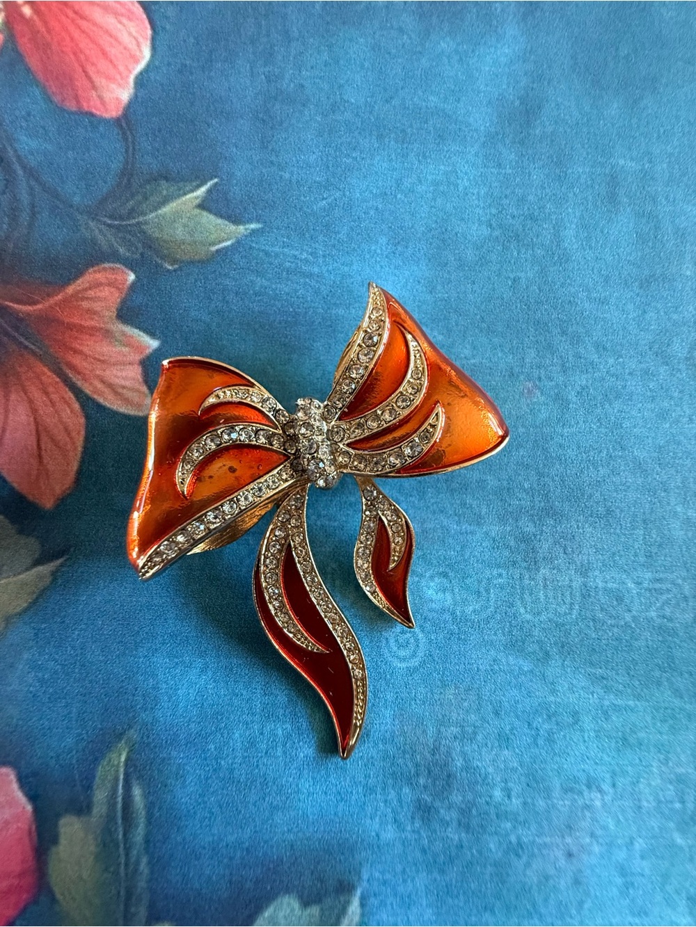 Vintage-Inspired Orange Enamel Bow Brooch with Crystal Accents